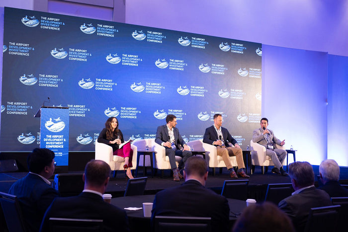 Panel discussion on the main stage at ADIC 2026