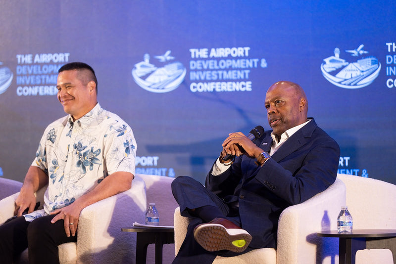 Panelists sharing a light moment on stage at ADIC 2026