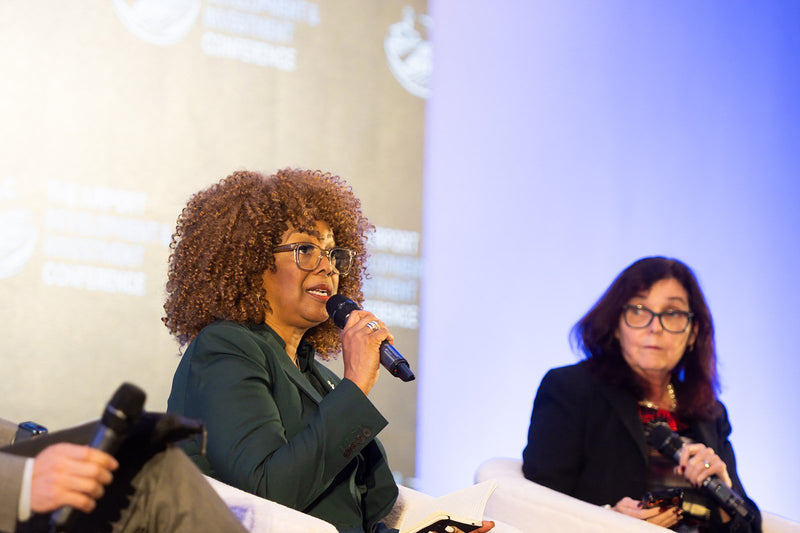 Panelist speaking during a session at ADIC 2026