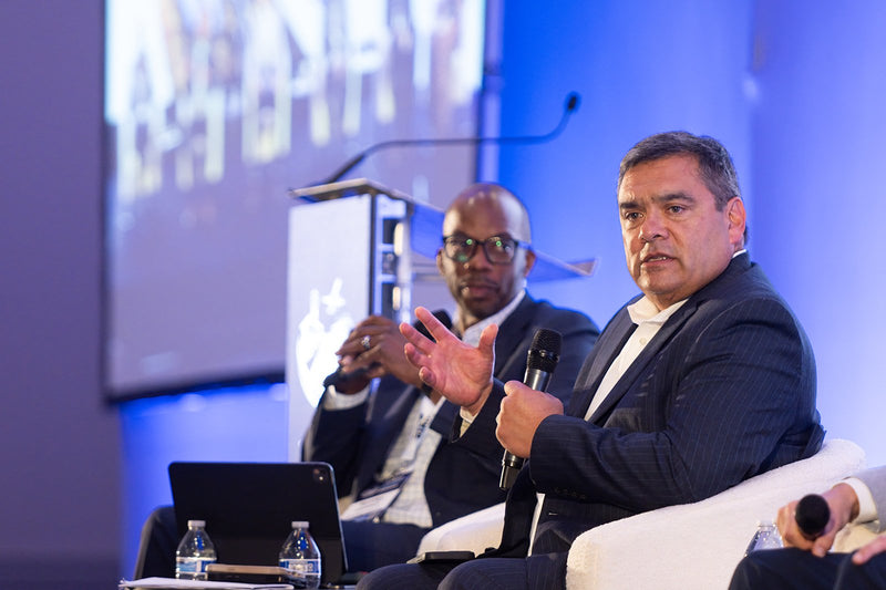Panelist gesturing while speaking at ADIC 2026
