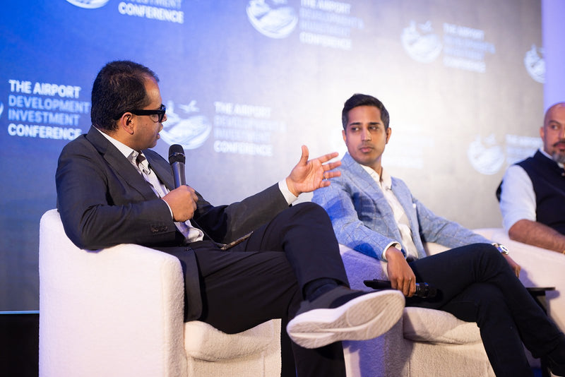 Moderator leading a panel discussion at ADIC 2026