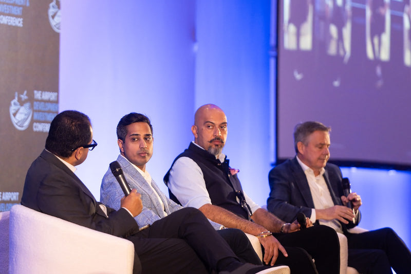 Four panelists on stage at ADIC 2026