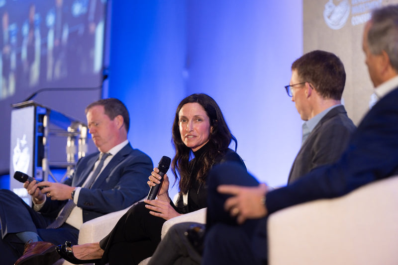 Panelist speaking during a main stage session at ADIC 2026