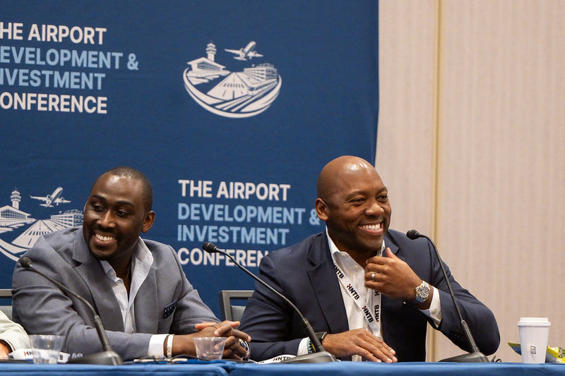 Panelists sharing a laugh during a breakout session at ADIC 2026