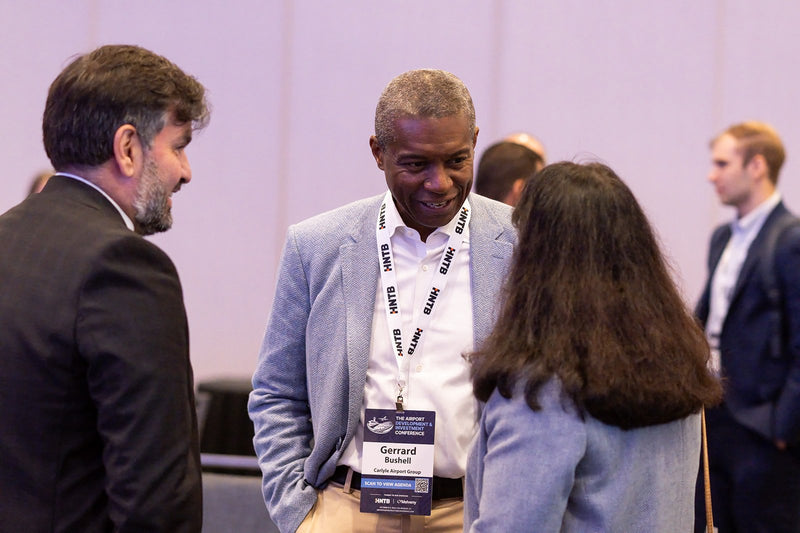 Attendees talking between sessions at ADIC 2026