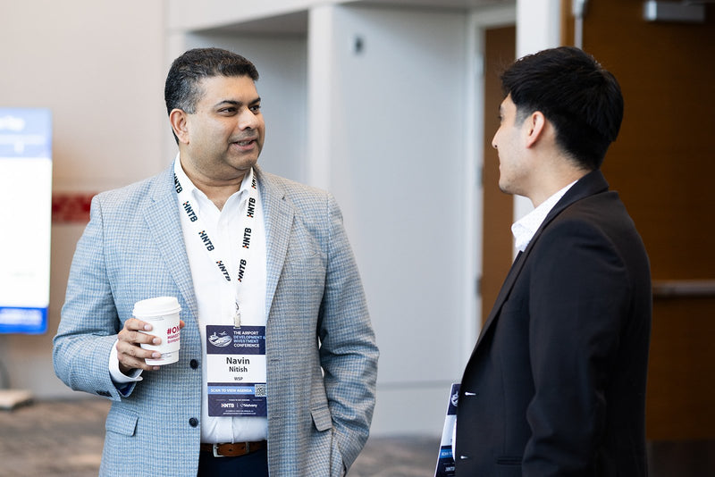 Attendees talking over coffee at ADIC 2026