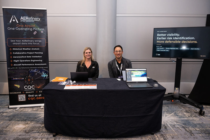 Exhibitors at their table in the expo area at ADIC 2026