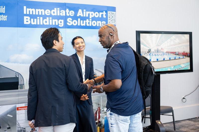 Attendees visiting an exhibitor booth at ADIC 2026