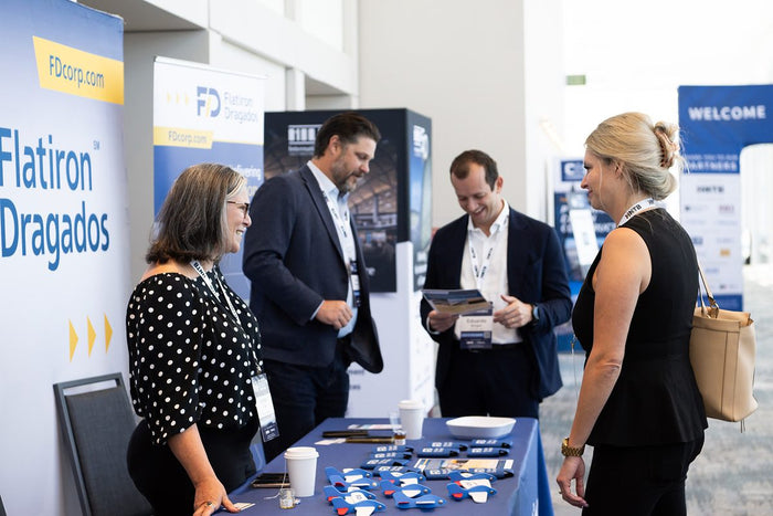 Exhibitors and attendees in the ADIC 2026 exhibit hall