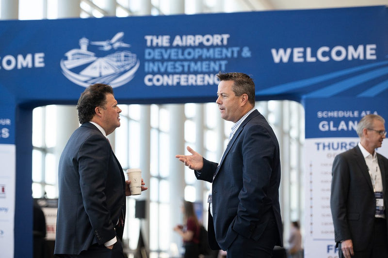 Attendees at the ADIC 2026 exhibit hall entrance