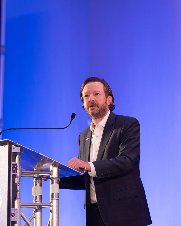 Speaker presenting at ADIC 2026
